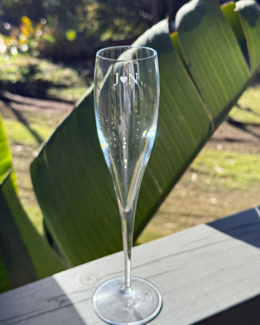 Clear champagne flute with personalised engraving.